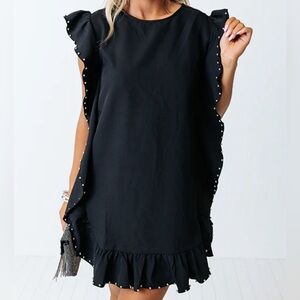 Black ruffled shift dress with silver beaded accents. Adorable!